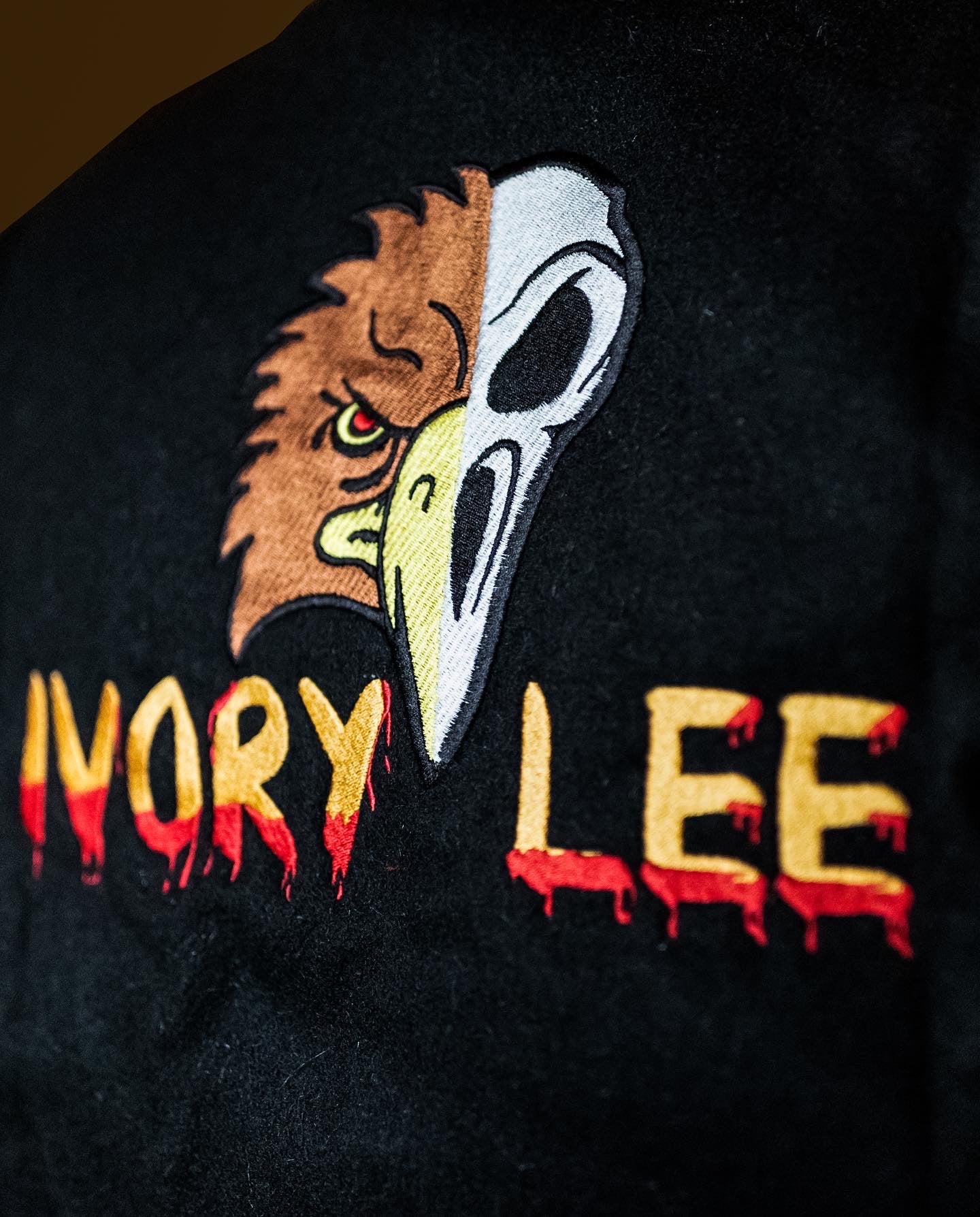 Ivory Lee's black & yellow "Buried Alive" varsity jacket