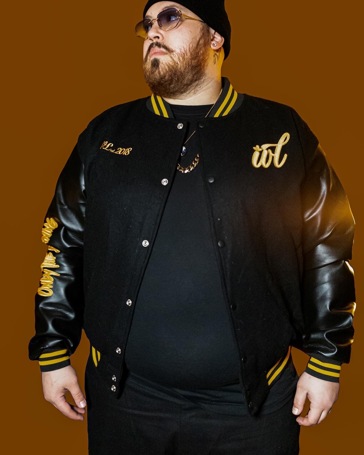 Ivory Lee's black & yellow "Buried Alive" varsity jacket